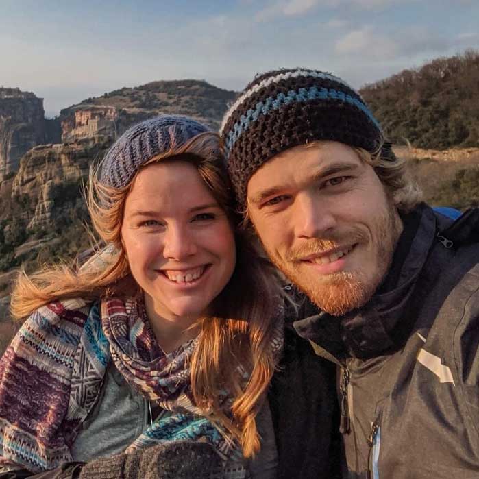 Smiling female and male alumni headshot