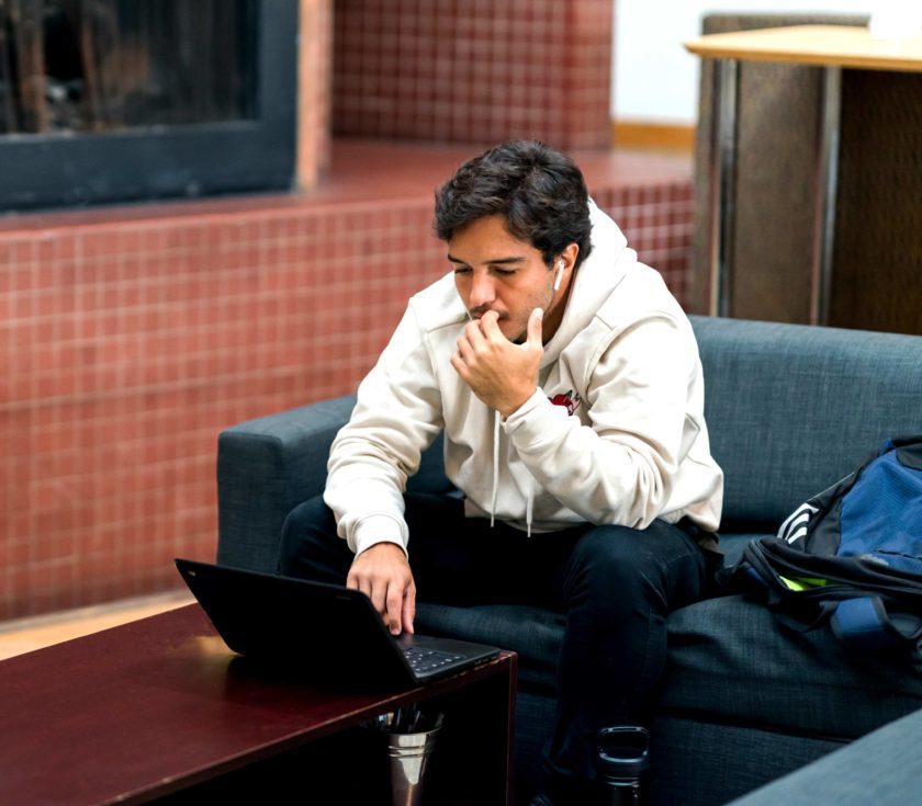 Student studying in the commons area