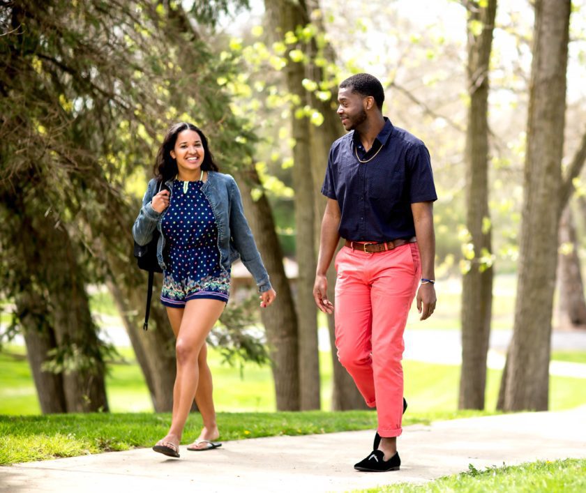 Students walking and talking on campus