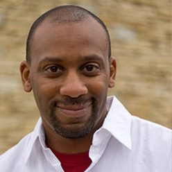 Smiling older man alumni headshot