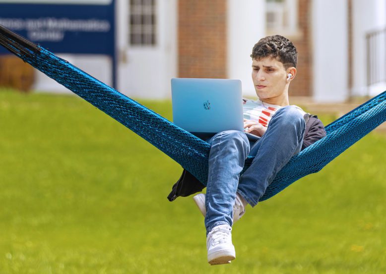 Student studying in hammock