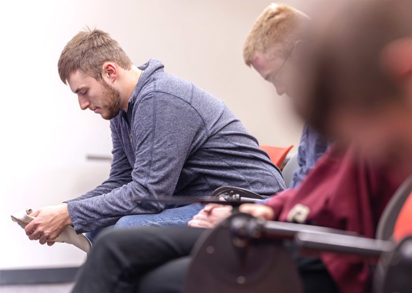 Students praying during class