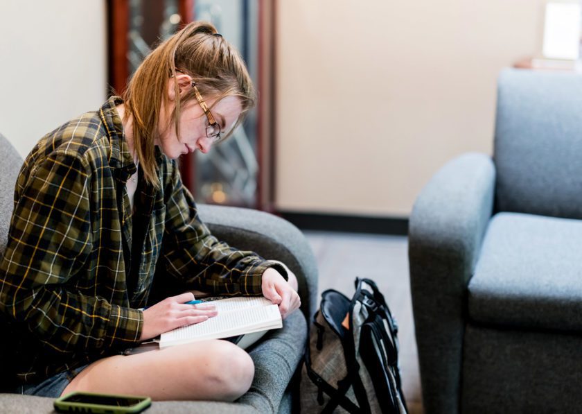 Student studying in Thompson Hall