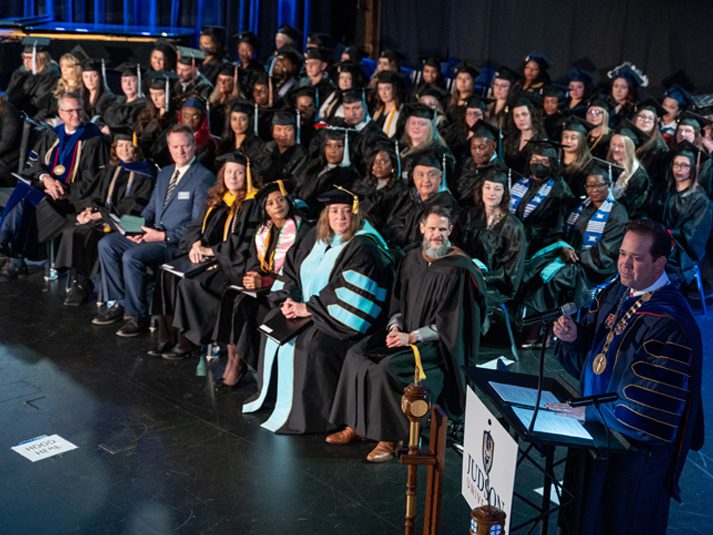 Dr. Adam Wright delivers the commencement address during Judson's December 2022 ceremonies.